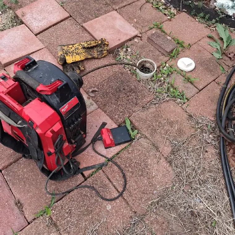 Sewer machine set up at a cleanout for drain cleaning service near Muskogee