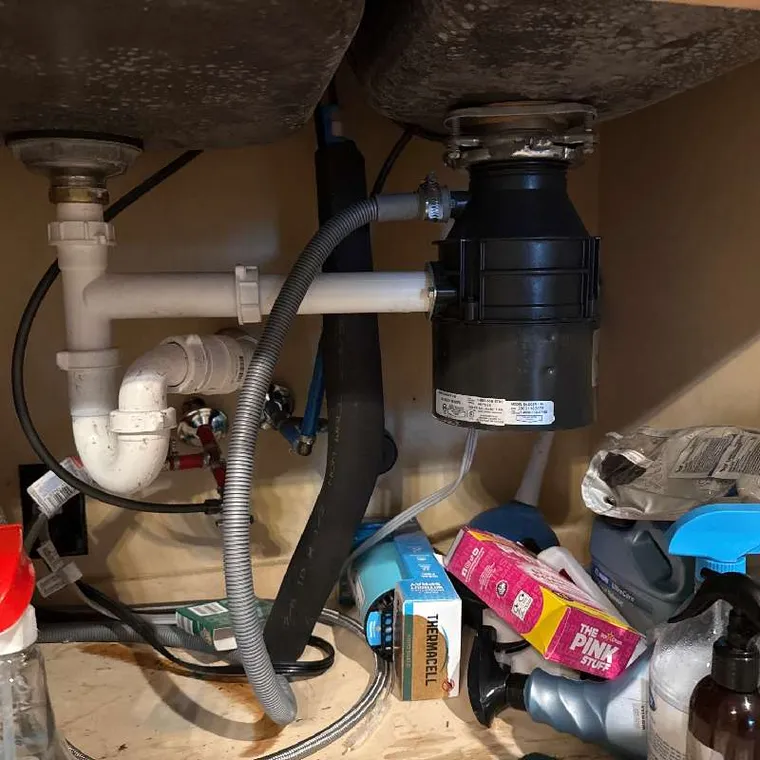 Sink drain cleaning under a cabinet in Tahlequah