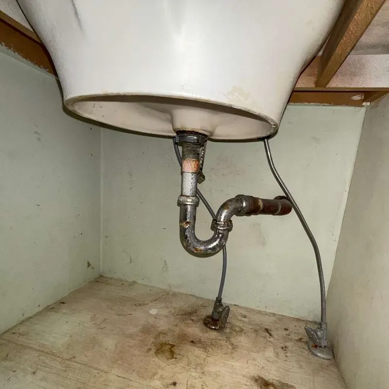 Sink drain cleanout service under a bathroom sink in Tahlequah