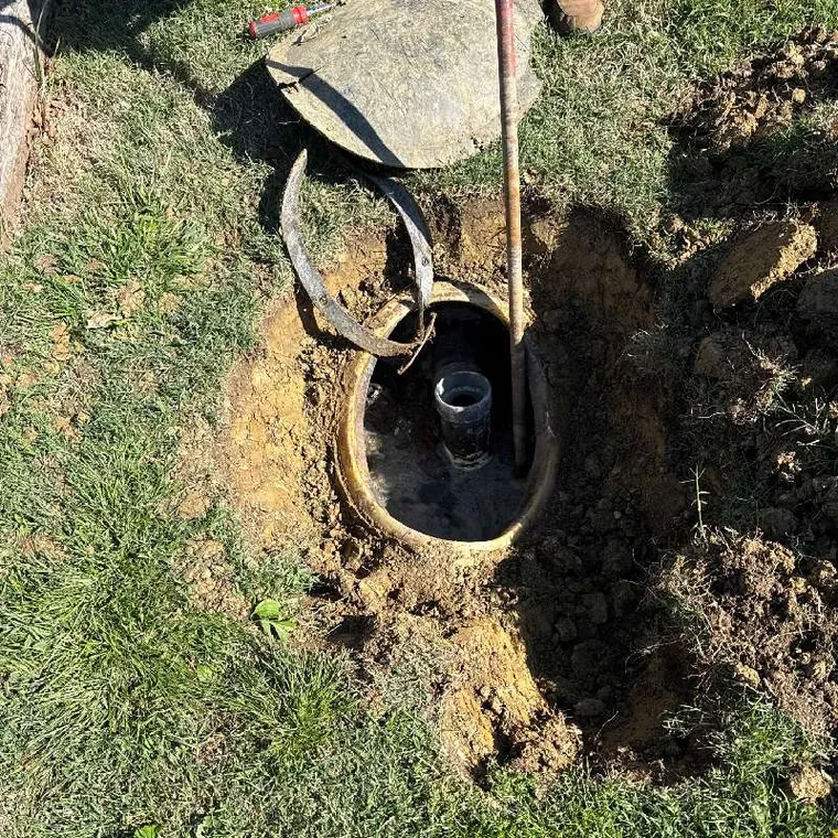 Open septic tank access during a Clog Hunter septic pumping service in Stilwell OK