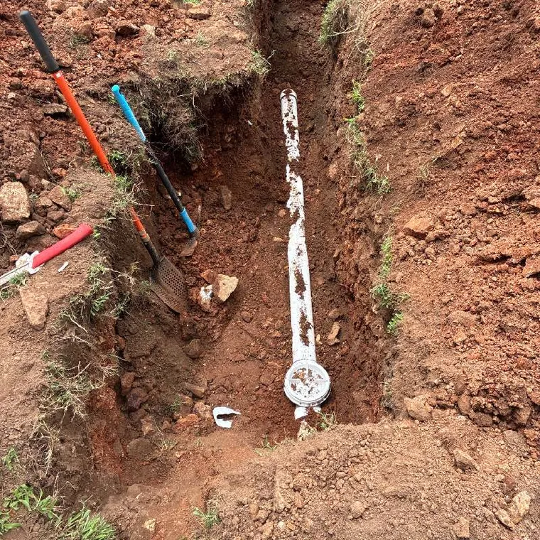 Exposed sewer line repair trench in Tahlequah, OK