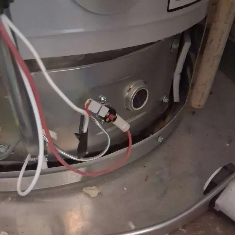 Rheem gas water heater burner assembly and wiring inspection during repair service in Tahlequah, Oklahoma