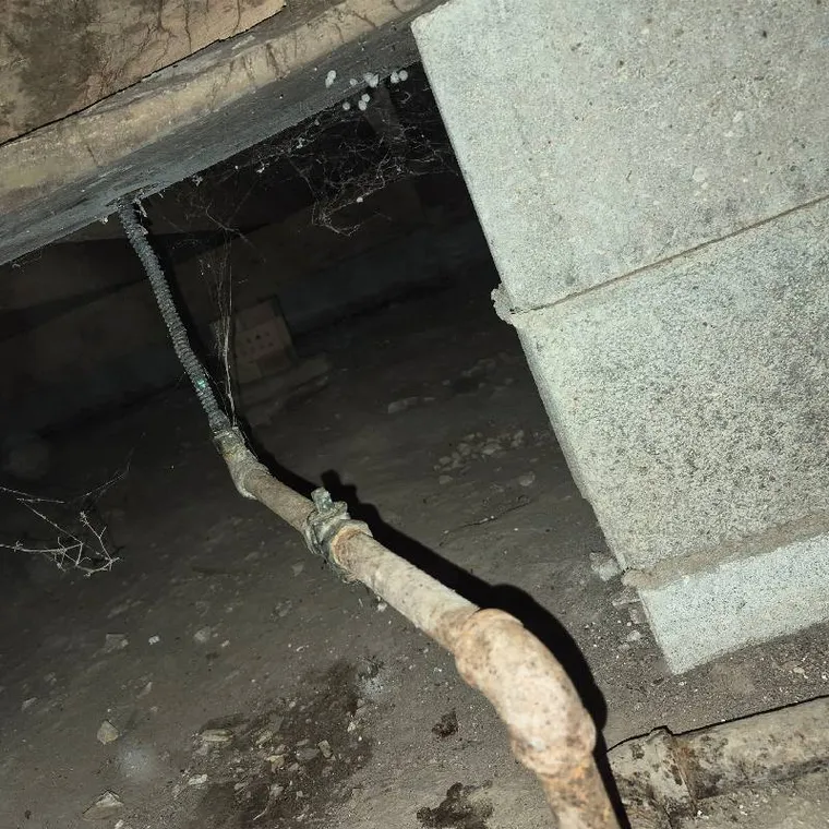 Gas line connection under a crawlspace during a pressure test in Tahlequah