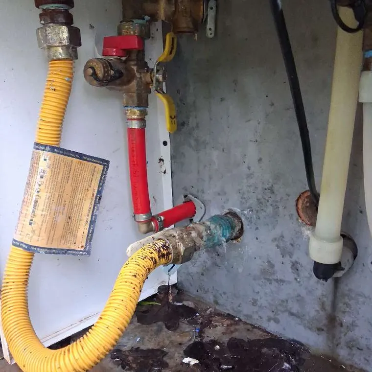 Water heater gas line and piping area during a leak repair in Tahlequah, OK.