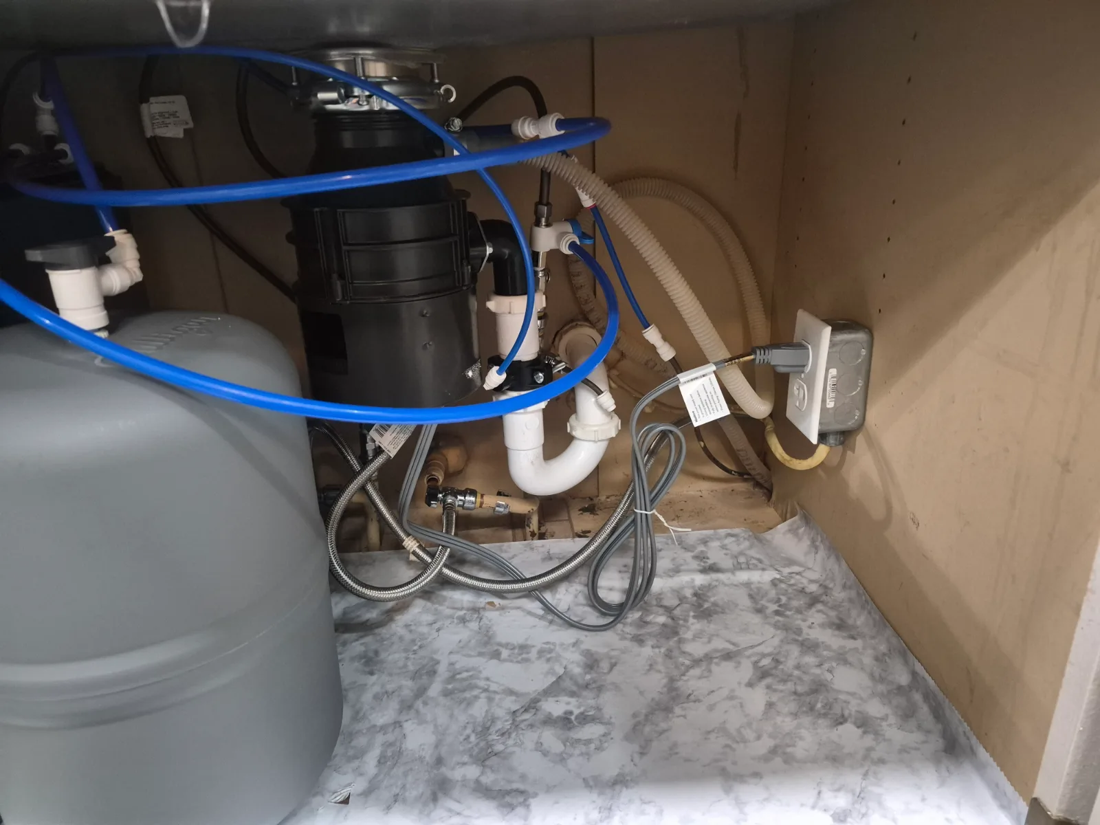 Clog Hunter completing a kitchen drain service and garbage disposal replacement in Muskogee, OK