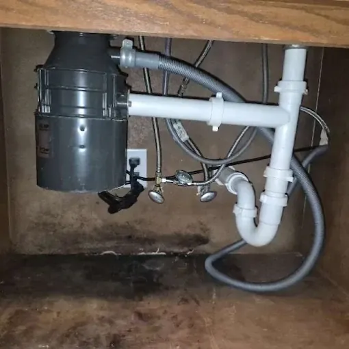 Clog Hunter replacing a garbage disposal and under-sink plumbing
