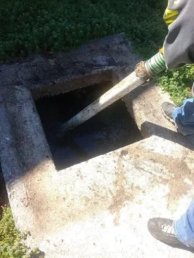 Clog Hunter pumping a septic tank on a rural Eastern Oklahoma property